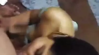 Cute girlfriend in bra giving blowjob to boyfriend
