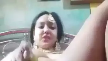 Newly married nude desi lady fucks her pussy with a banana